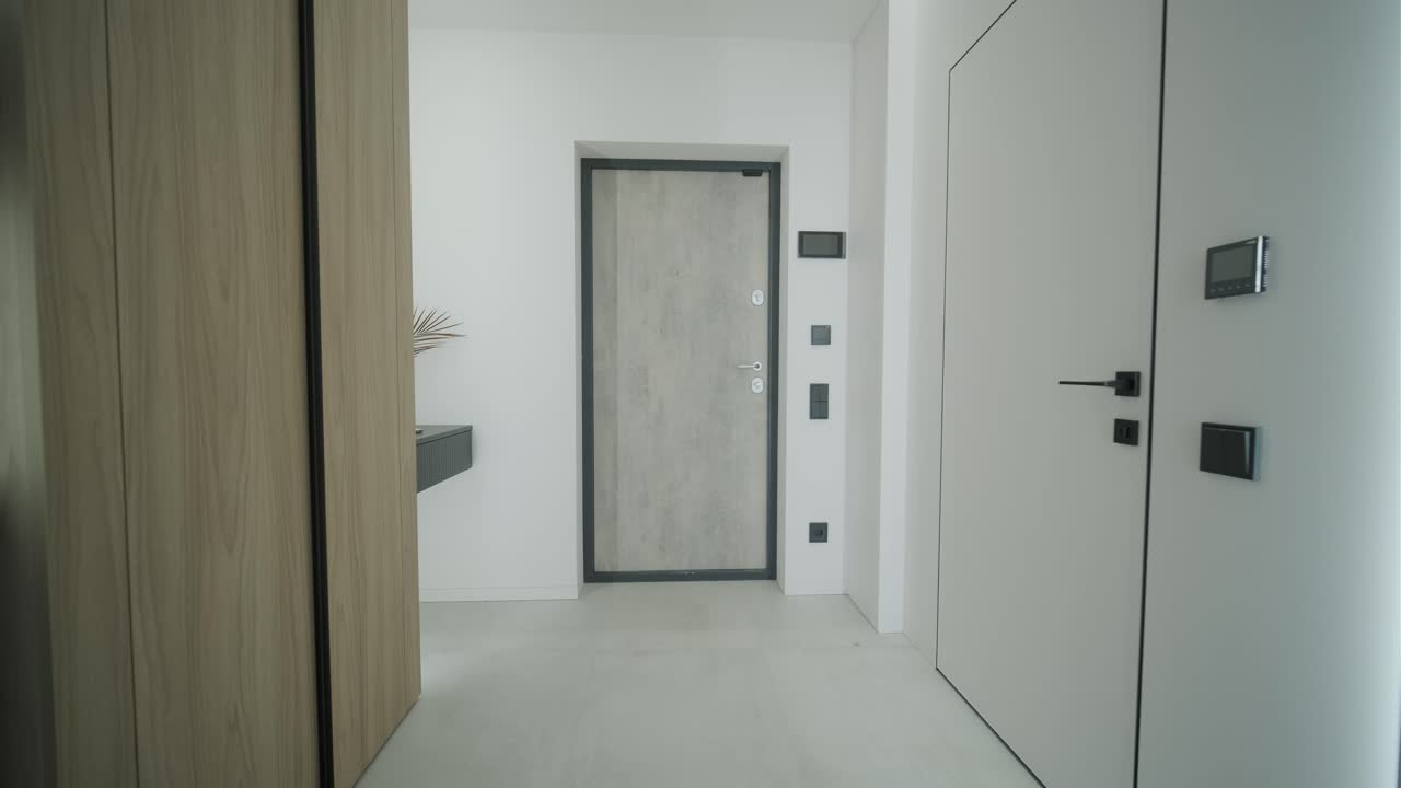 Modern Minimalist Hallway with Gray Door