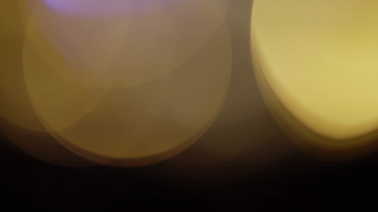 la luz multicolor filtra imágenes de 4k sobre fondo negro, vídeo estilizado, transiciones, efecto bokeh