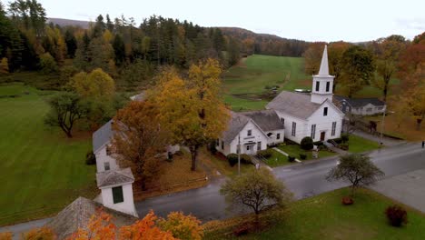 new england fall color in east arlington vermont with church in background