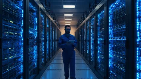 a technician navigating through a high-tech server room filled with illuminated racks of servers, showcasing a modern data center in action