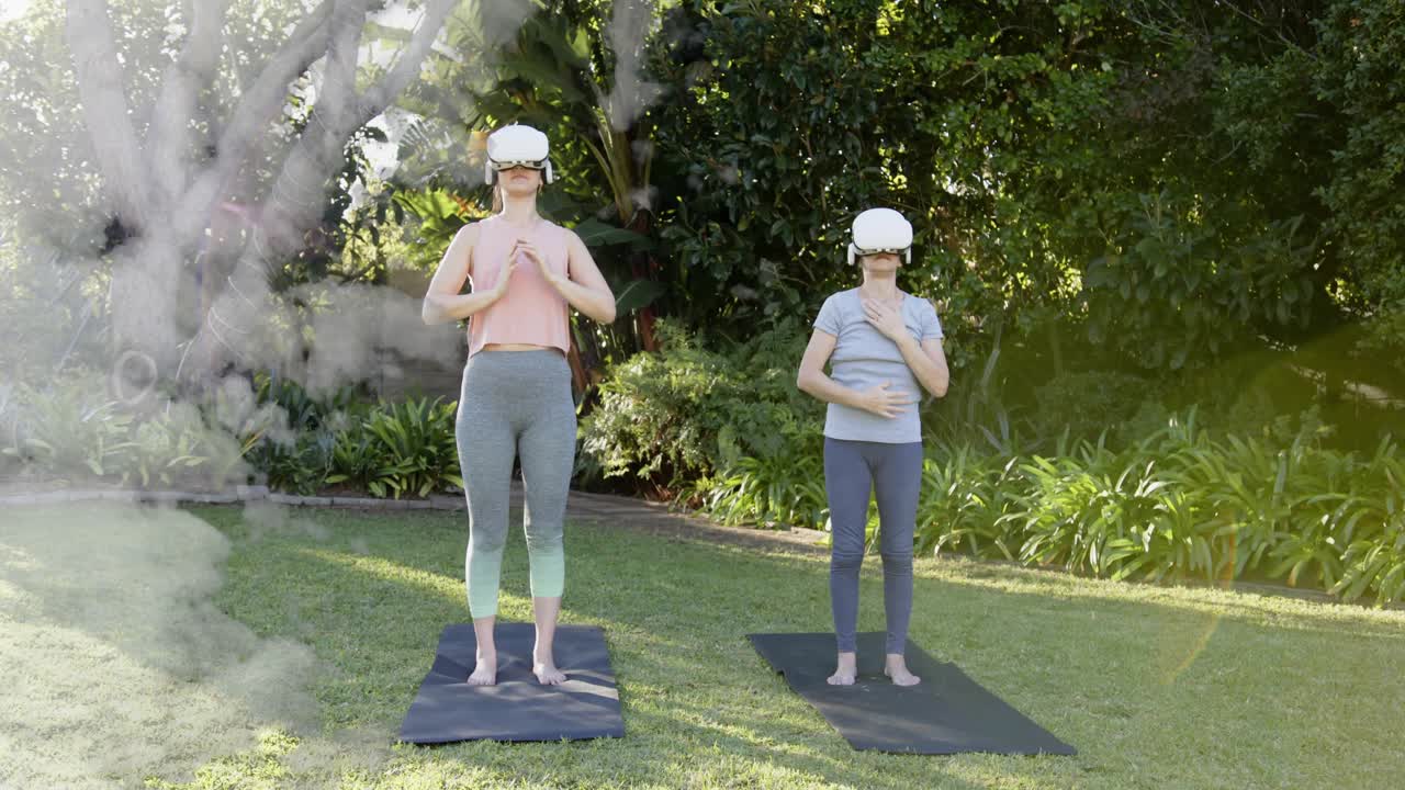 Mom and daughter in VR starting guided breathing, doing namaste flow while mist overlay appearing