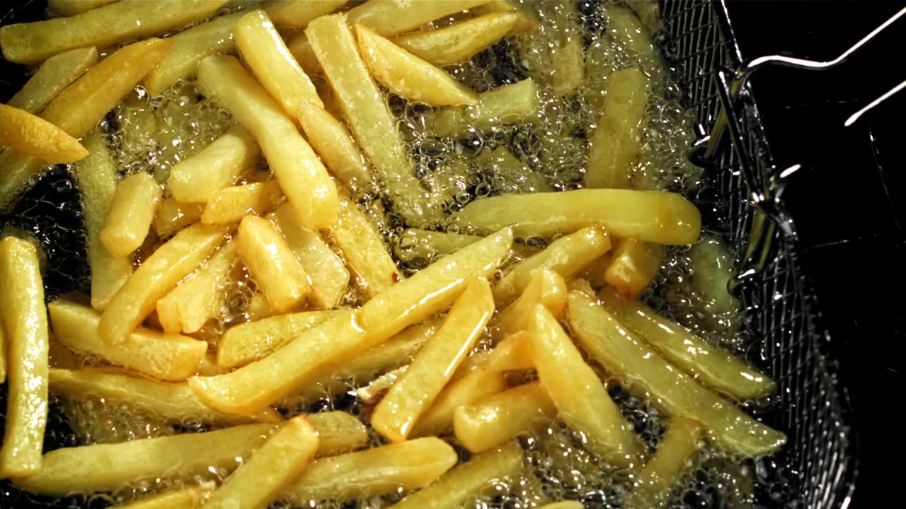 Golden French Fries Deep Frying in Hot Oil
