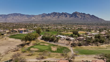 tucson arizona aerial v4 low flyover oro valley canada hills residential neighborhoods capturing el conquistador golf course overlooking at desert mountainscape - shot with mavic 3 cine - march 2022