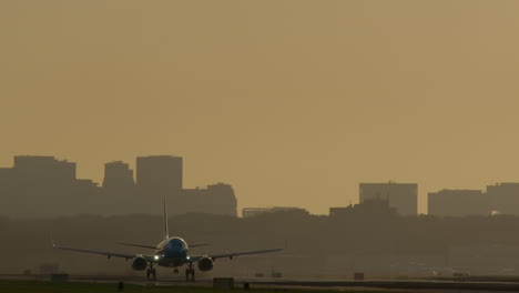 airplane taking off/landing at sunset