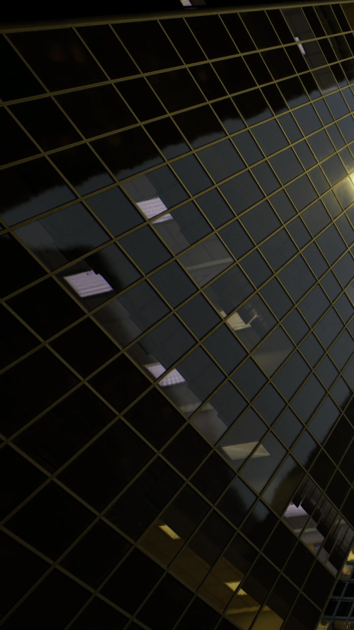 Reflection of a city street through glass at night with warm lights