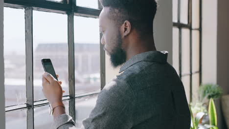 window, smartphone and businessman with coffee