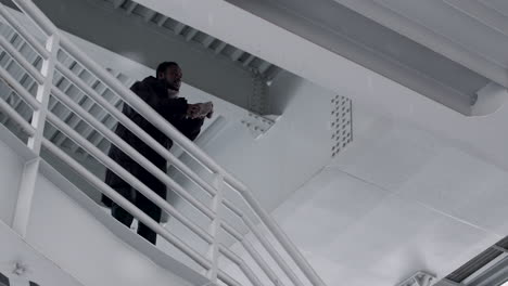 Sad person on the top of the stairs