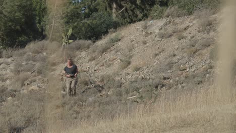 Military-woman-running-through-battle-station-with-machine-gun-in-hand