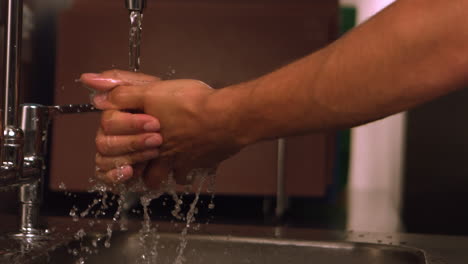 hands washing under water tap