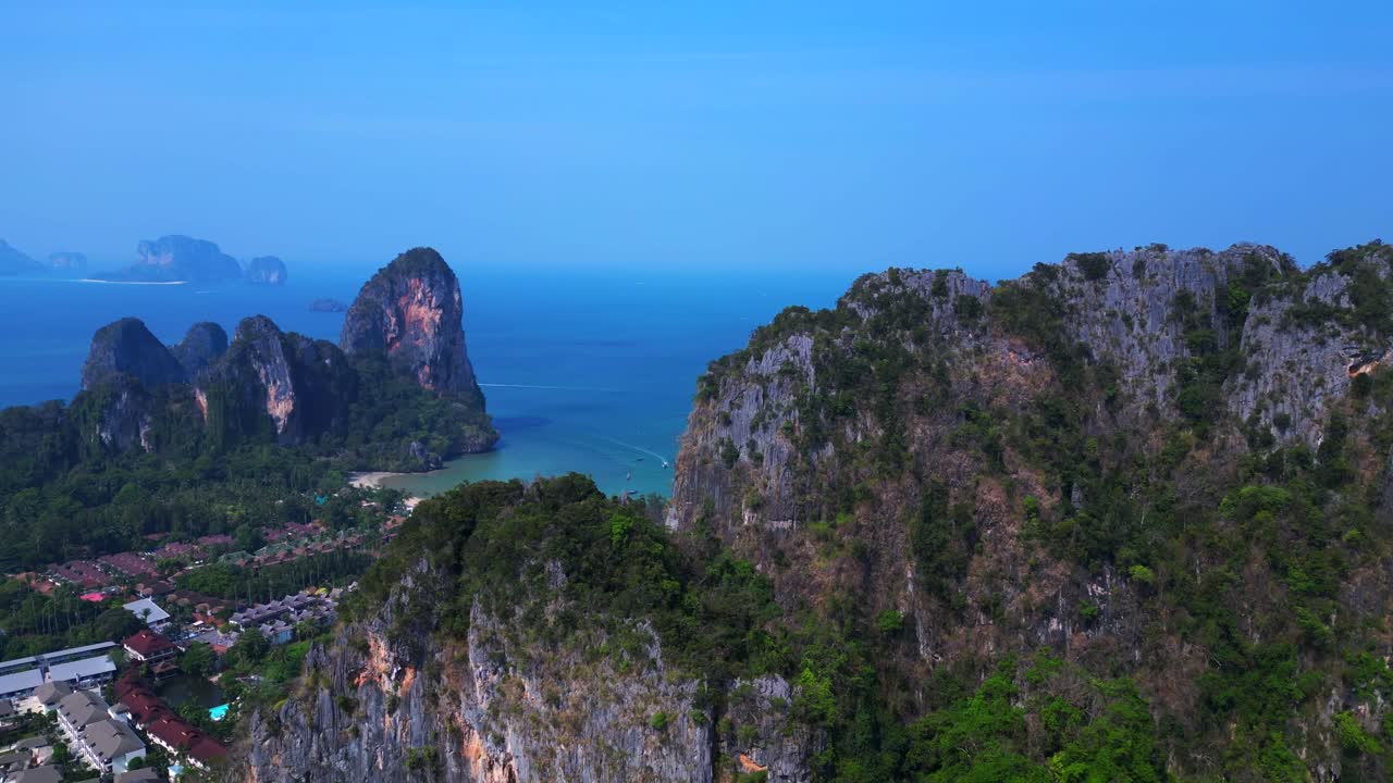view of Railay Beach and Phra Nang Beach from a mountain viewpoint in Krabi, Thailand. Fabulous aerial view flight descending drone
