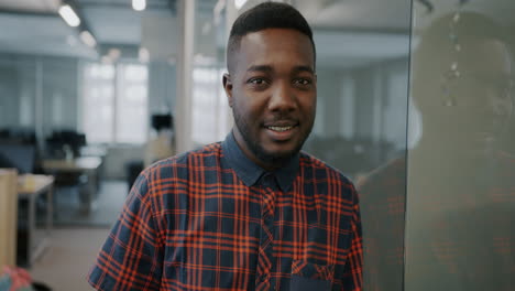 happy african american man in modern office
