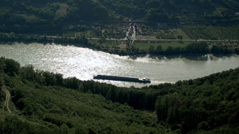 cargo ship travel along the danube rive