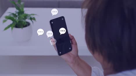 animación de las reacciones de las redes sociales sobre las manos de un hombre asiático que usa un teléfono inteligente