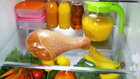 Open-refrigerator-filled-with-food