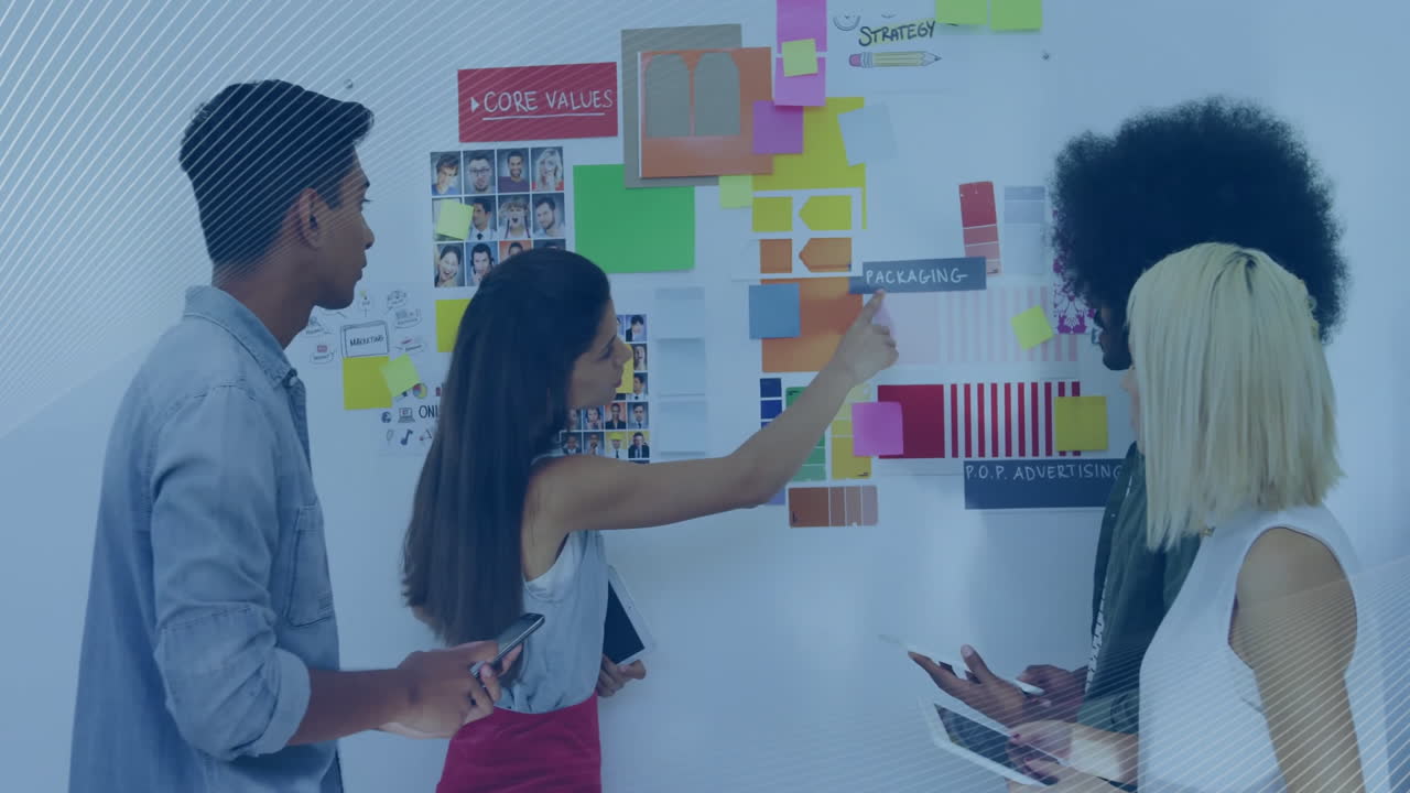 Discussing design concepts, team collaborating on creative strategy in office