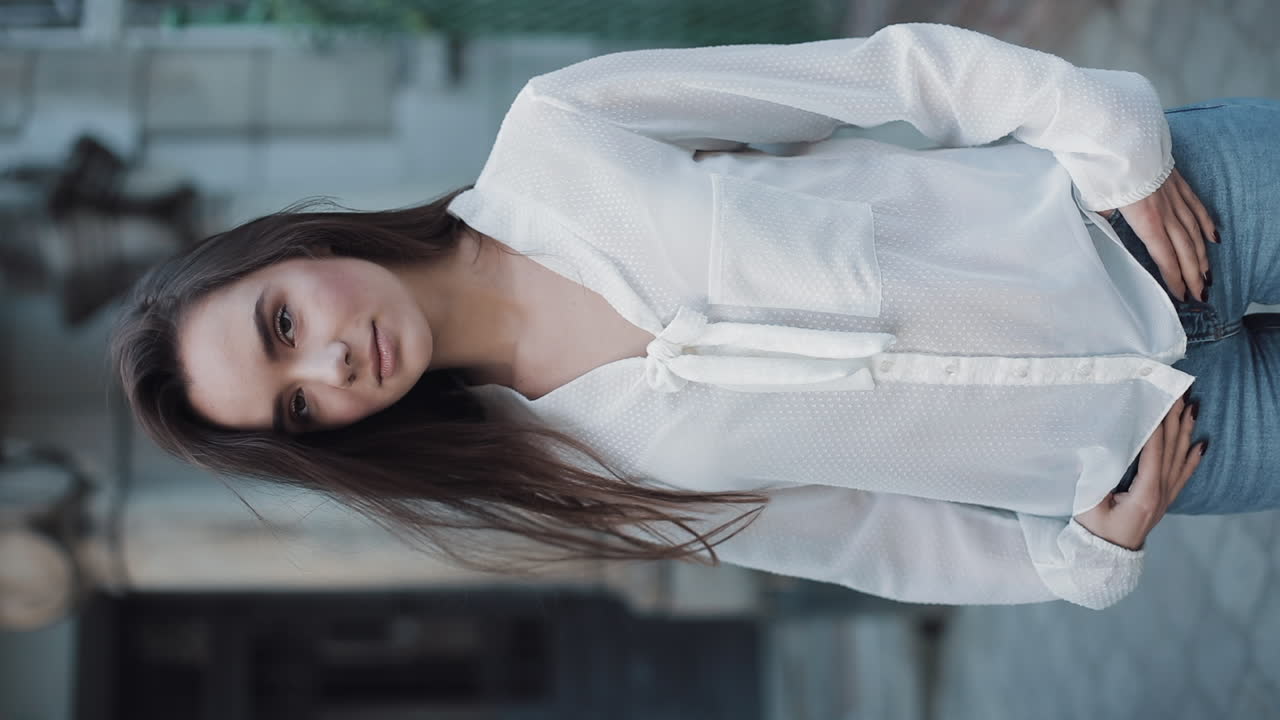Woman in white blouse and jeans