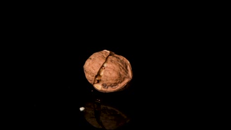 cracking the walnut shell with a hummer in slow motion