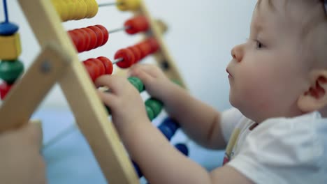 child plays with a multi-colored toy 3