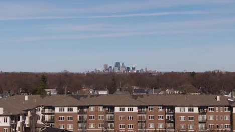 Minneapolis-in-the-distance,-parallax-4k-drone-clip