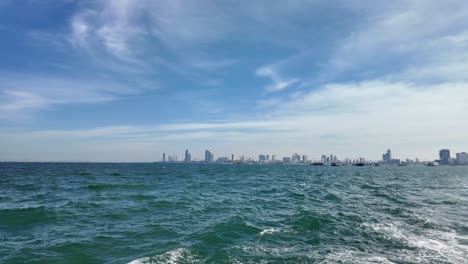 pattaya city thailand building skyline ferry ride to koh larn island speed boat southeast asia