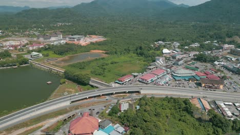 aerial drone view, serian district town ,summer with beautiful green trees,new building and water park lake, water from the mountain sarawak,borneo.