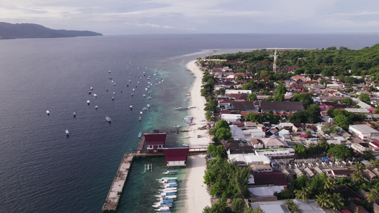 Aerial view over the coastline of Gili Trawangan, sunny evening in Indonesia