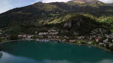 stunning aerial view of a lakeside village in the swiss alps
