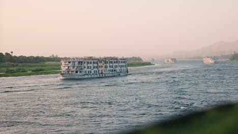 a convoy of cruise ships travelling down the nile river