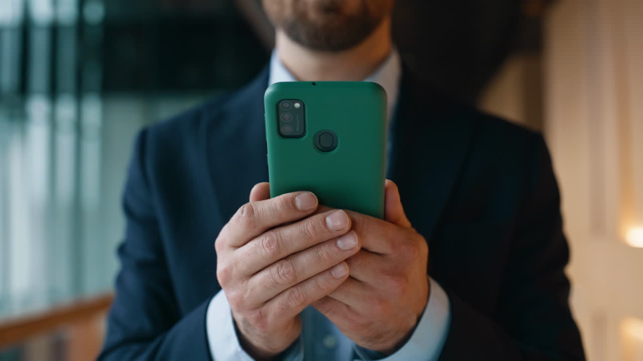 Director hands holding cellphone in office hallway closeup. Elegant entrepreneur