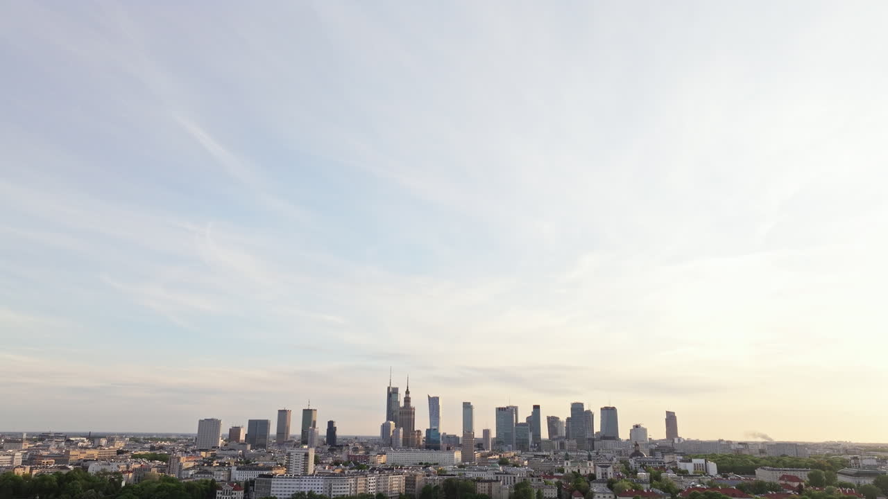 Warsaw Skyline With High-rise And Skyscrapers At Sunset In Poland. - tilt down shot