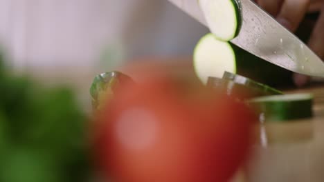 Chef-in-kiitchen-cutting-cucumber