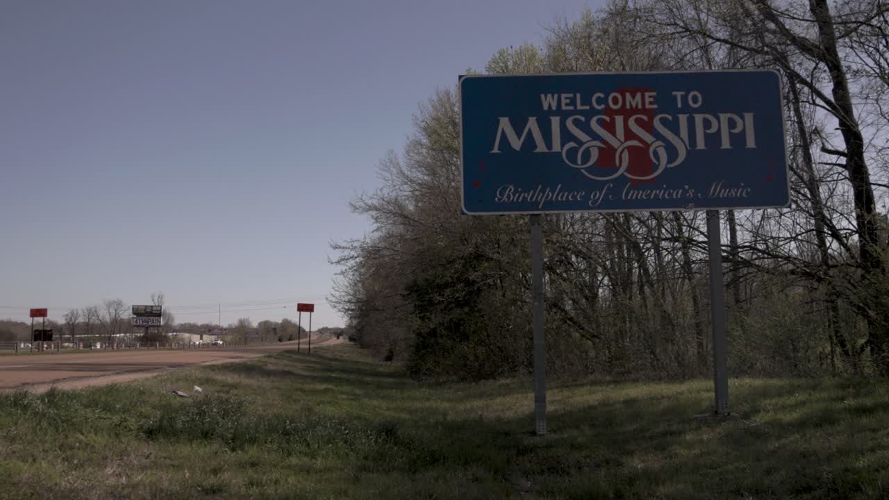 Welcome to Mississippi, birthplace of America's music, state line sign on the side of the freeway with stable video