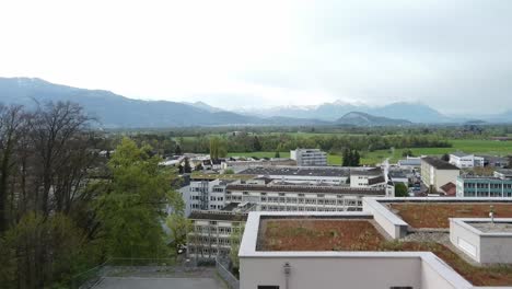 aerial shot of an industrial town in the mountains of europe