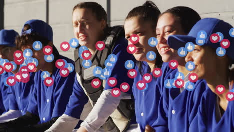 animation of emoji icons over diverse female baseball players