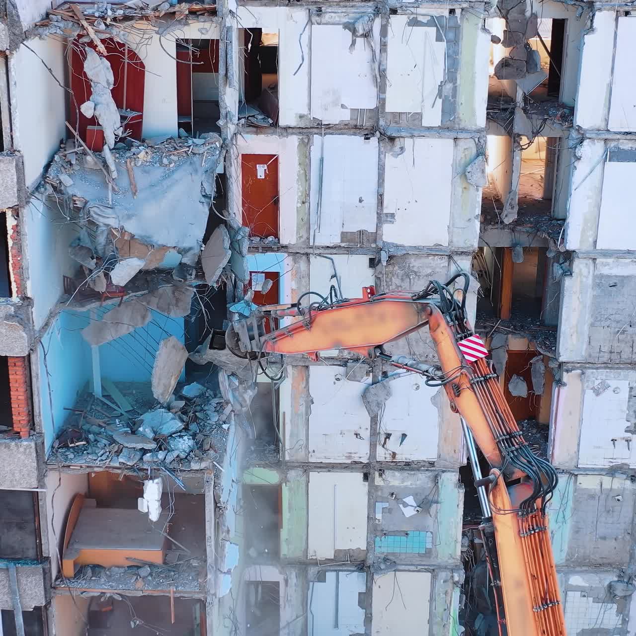 Excavator demolition constructions. Aerial view of destruction by machine