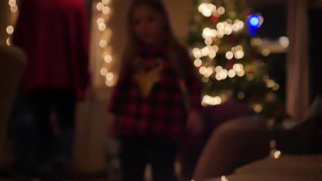 little girl walking over to christmas lights