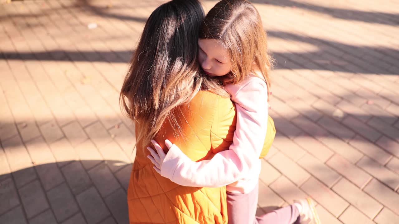 A mother and daughter sharing a loving hug