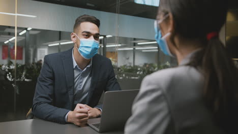business meeting with face masks in office