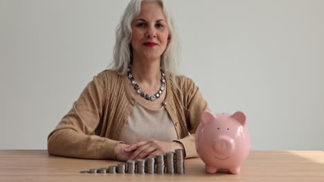 senior woman saving money in a piggy bank with growing stacks of coins