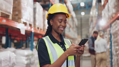 warehouse worker using cellphone