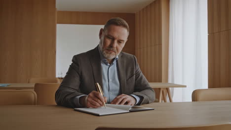 businessman writing notes