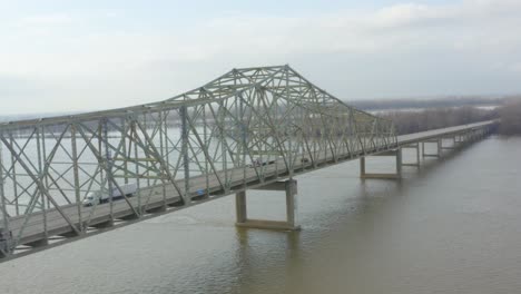 aerial shot of a trailer crossing over a bridge