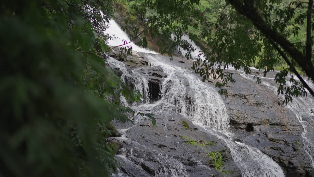 Amazing Camping Salto Piedras Blancas waterfall cascading through dense forest, Misiones, Argentina.