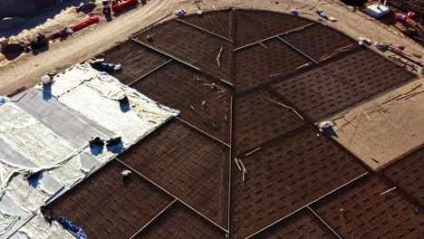 overhead aerial shot of foundation grids and coverings at a construction site