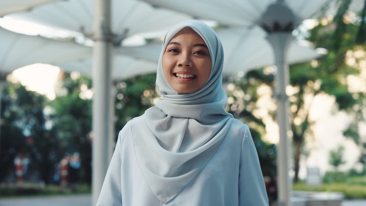 Portrait of a Smiling Woman in Hijab