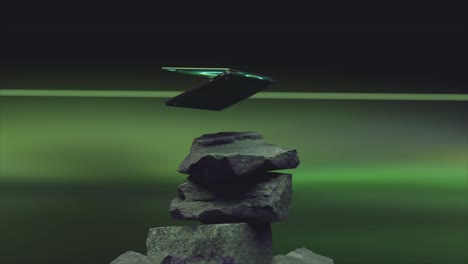 futuristic laptop on stack of rocks