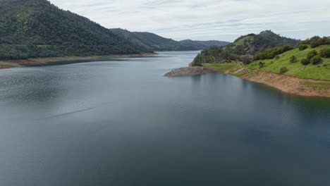 aerial zoom out of the don pedro reservoir in jamestown california. shot on a dji air 3s.