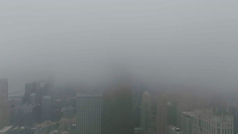 aerial hyperlapse of thick clouds covering the streeterville skyline in chicago, usa