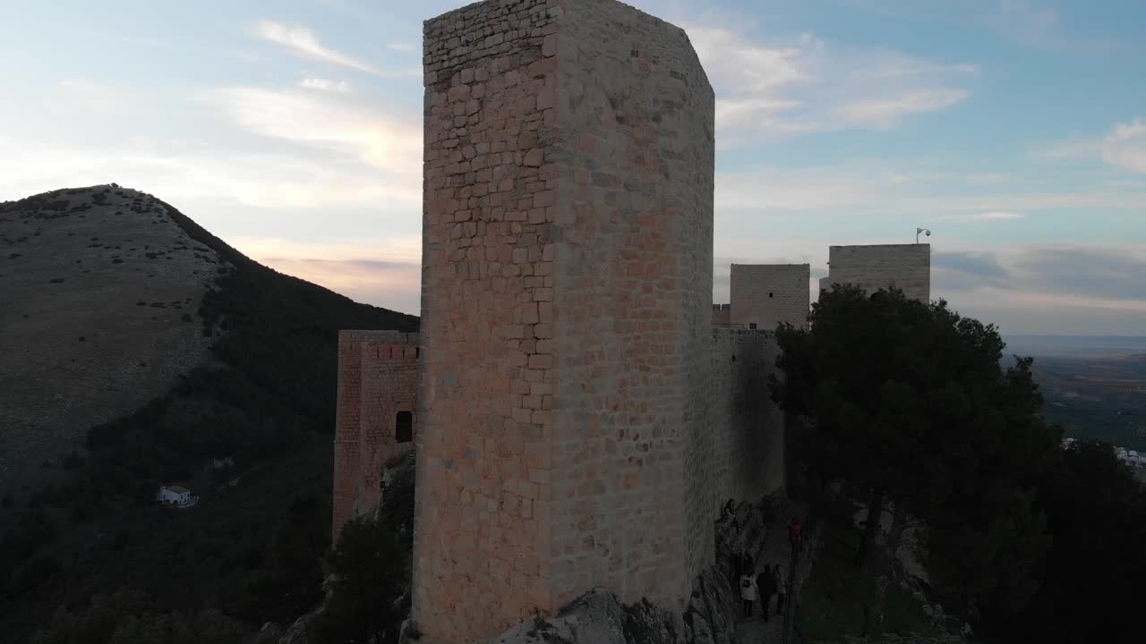 Jaen's Castle Saint Catalina Castle Spain shoot with a drone at 4k 24fps showing the exterior and the city from multiple points on a afternoon in December.