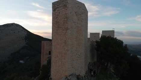 Jaen's Castle Saint Catalina Castle Spain shoot with a drone at 4k 24fps showing the exterior and the city from multiple points on a afternoon in December.